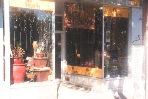 A clean entry and pleasing window display intrigues customers to explore.